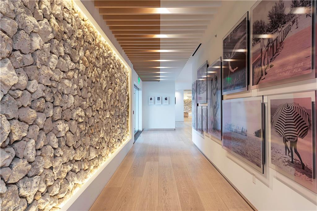 13915 Old Coast Road, Unit 602 Naples, FL 34110 - Photo 22 of 37 a view of hallway with stairs