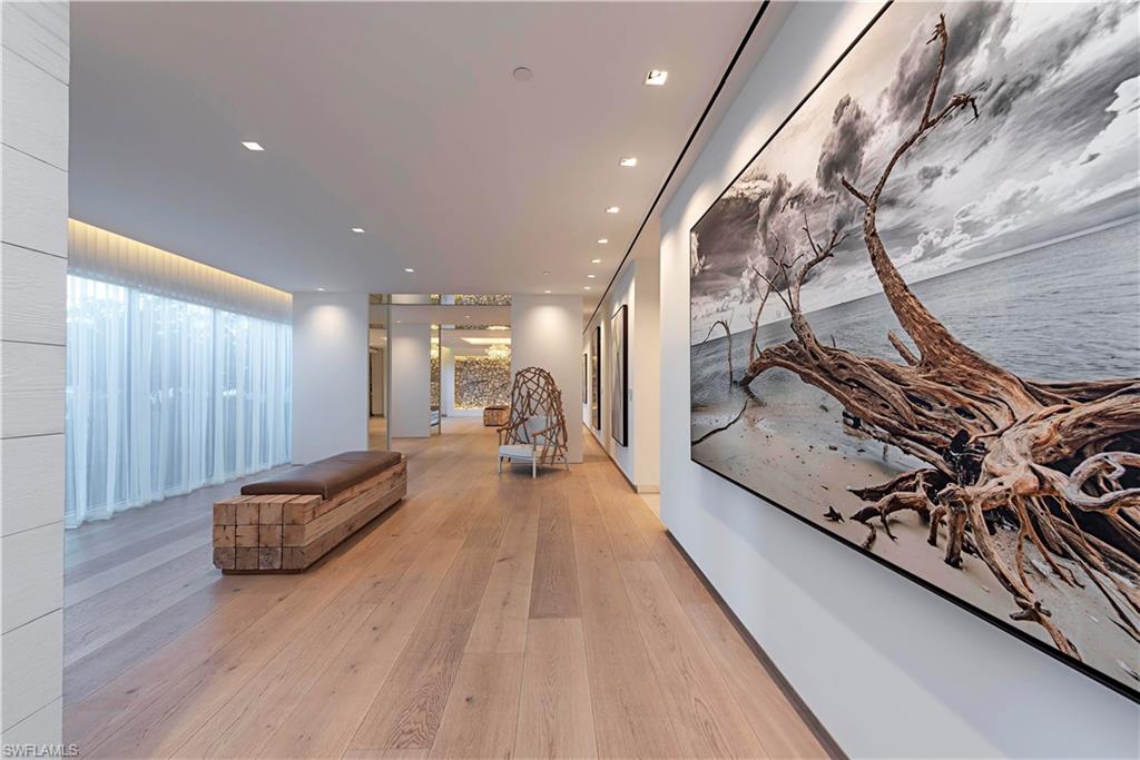 13915 Old Coast Road, Unit 602 Naples, FL 34110 - Photo 23 of 37 a living room with furniture and a rug