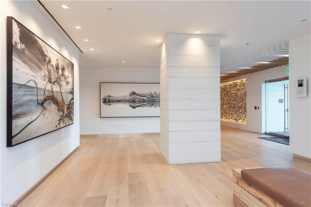 13915 Old Coast Road, Unit 602 Naples, FL 34110 - Photo 24 of 37 a view of an empty room and painting on the wall