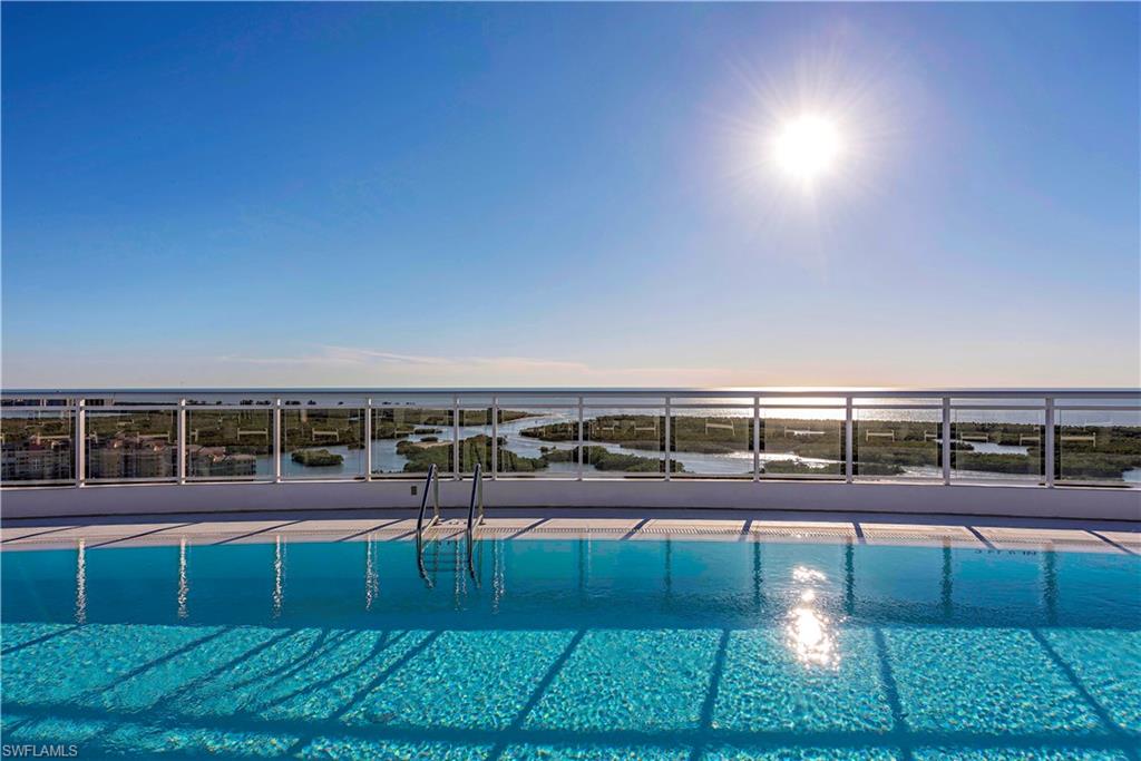 13915 Old Coast Road, Unit 602 Naples, FL 34110 - Photo 27 of 37 a view of a yard and a balcony