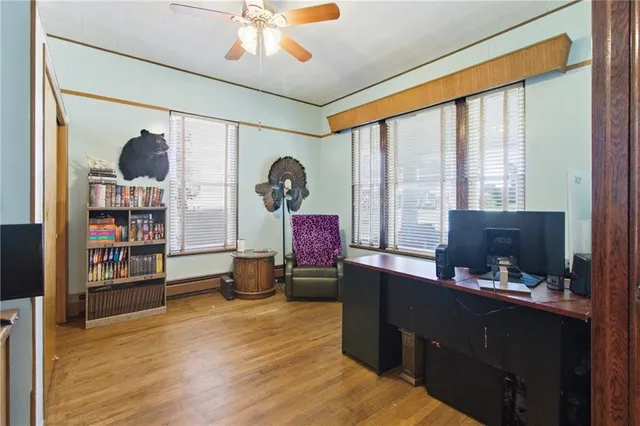 a bedroom with furniture and a window