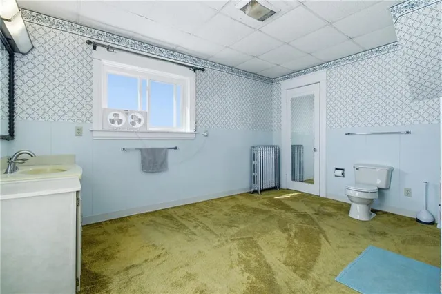 a view of a storage & utility room with a sink