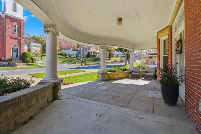 a view of a porch with seating space