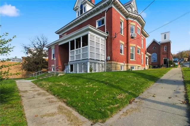 a view of a building with a yard
