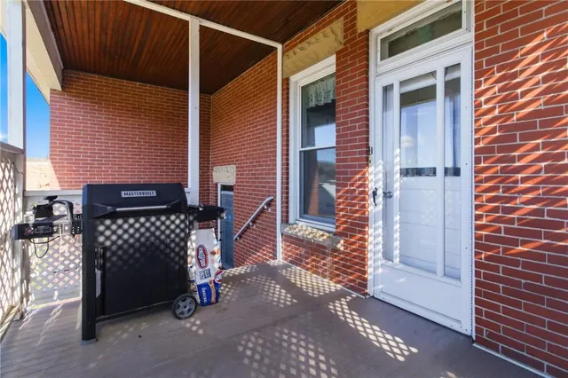 a view of a house with a door and wooden floor