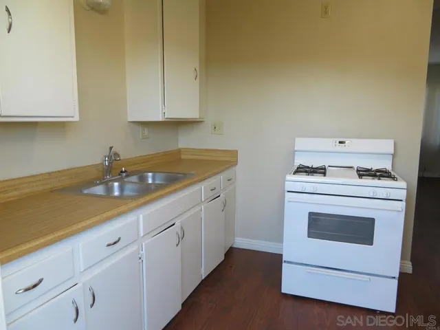 a bathroom with a sink a mirror and a shower