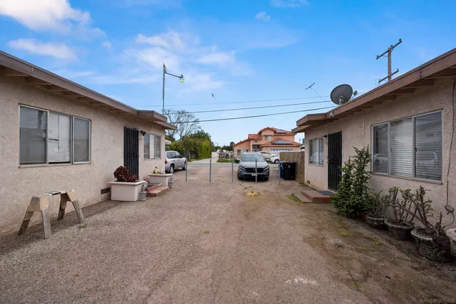 a view of a car park in front of house
