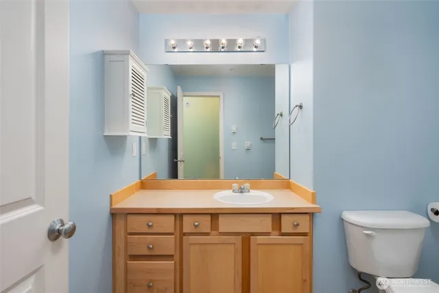 a bathroom with a sink and mirror