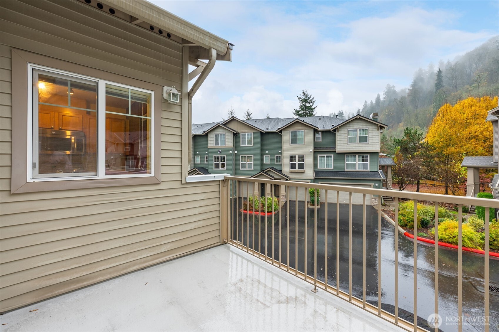 15325 Southeast 155th Place, Unit X4 Renton, WA 98058 - Photo 21 of 23 a view of a houses with a balcony