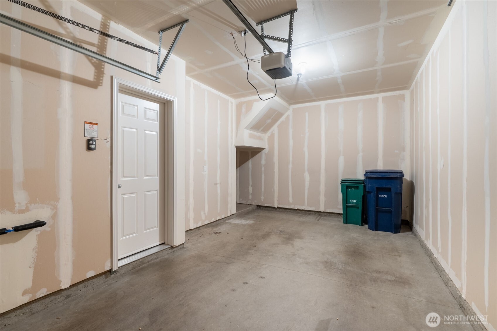 15325 Southeast 155th Place, Unit X4 Renton, WA 98058 - Photo 22 of 23 a view of entryway with wooden walls