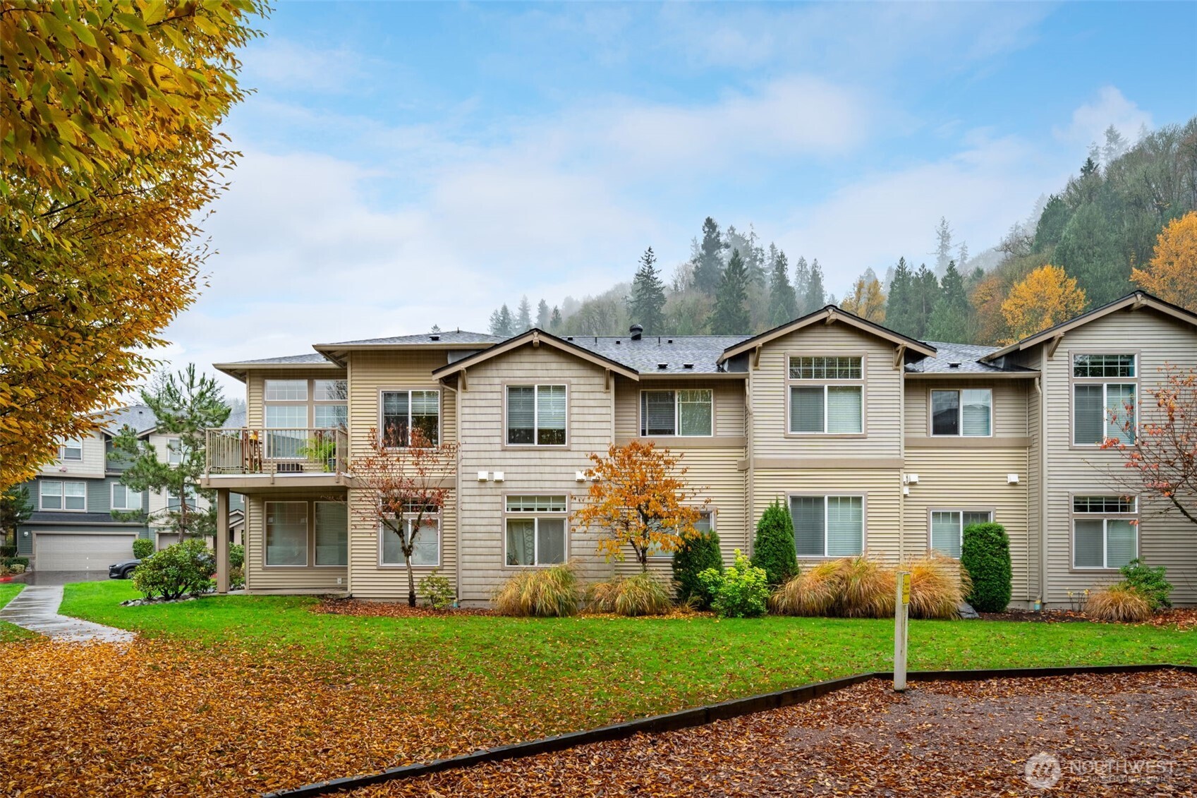 15325 Southeast 155th Place, Unit X4 Renton, WA 98058 - Photo 23 of 23 a front view of a house with a garden
