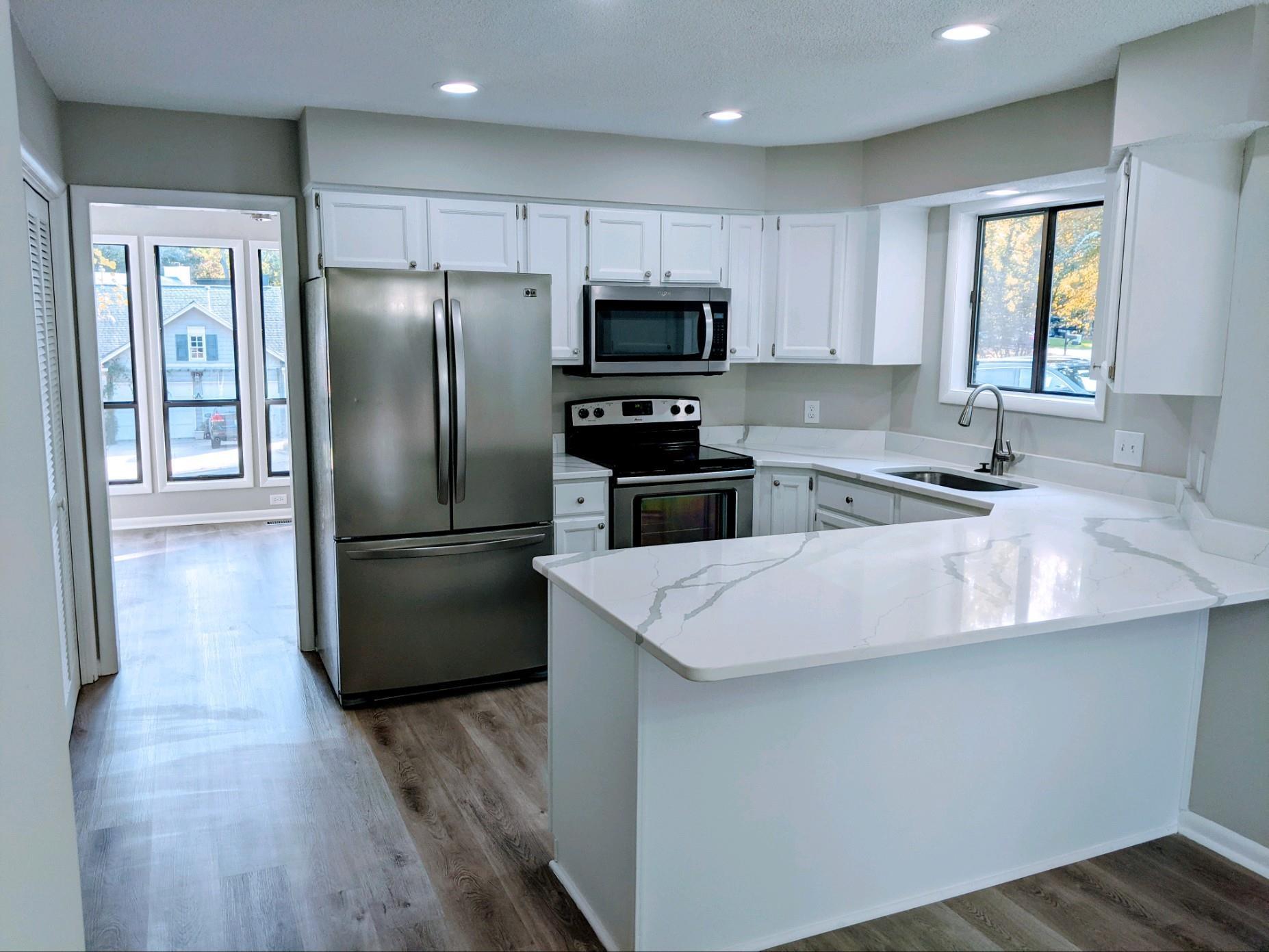 This open kitchen with doorway to your separate dining room Kitchen