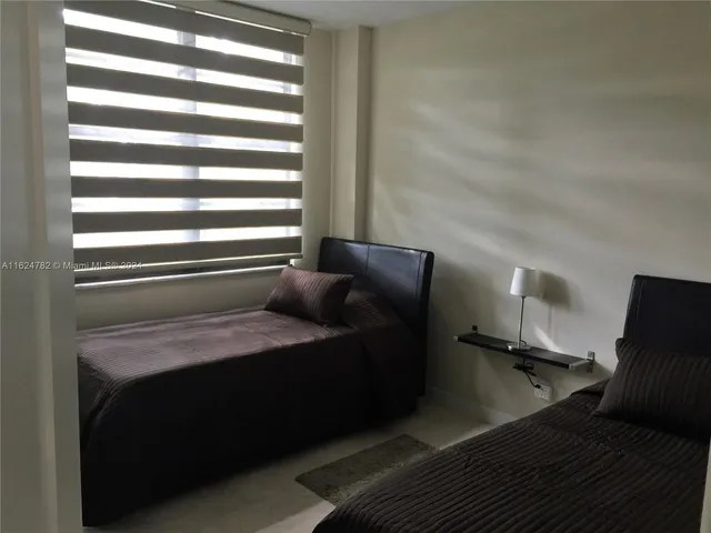 a room with a bed and a window