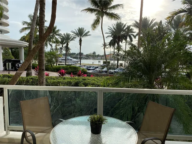 a view of a chairs and table in the patio