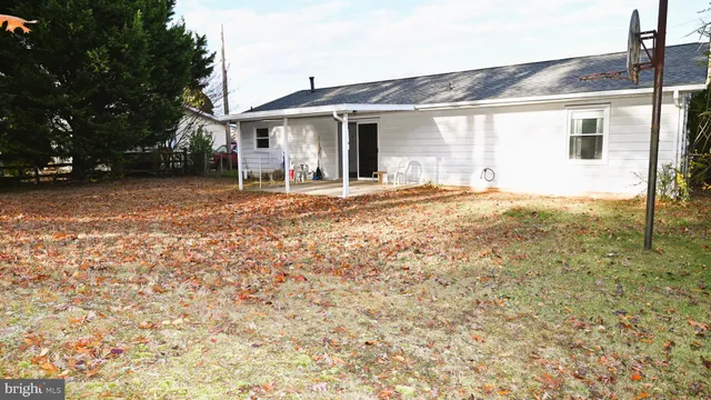 a view of a house with backyard and snow