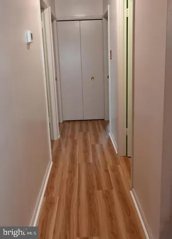 a view of a room with wooden floor and staircase
