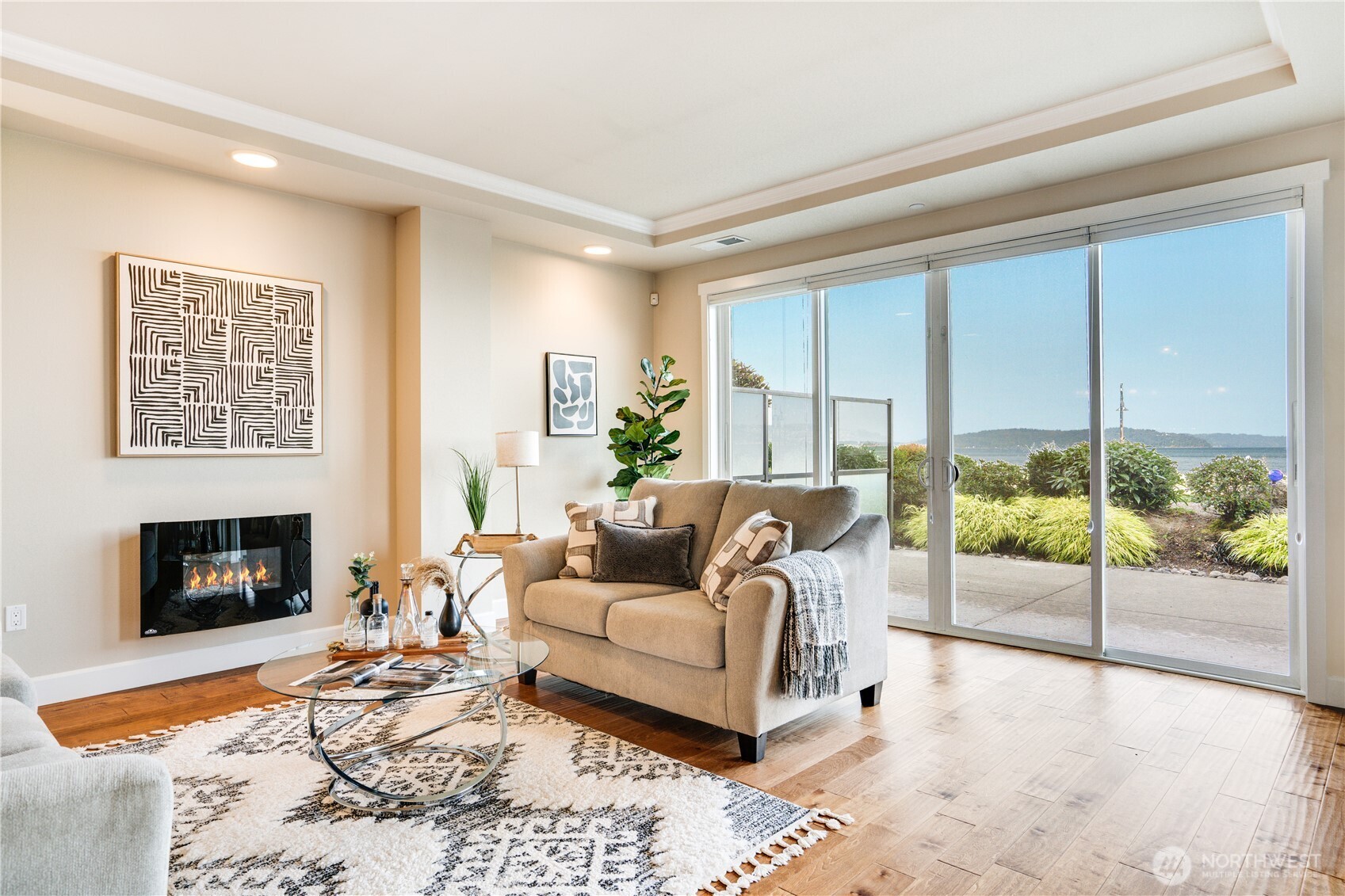 5105 Grand Loop, Unit 105 Tacoma, WA 98407 - Photo 11 of 39 a living room with furniture large window and a fireplace