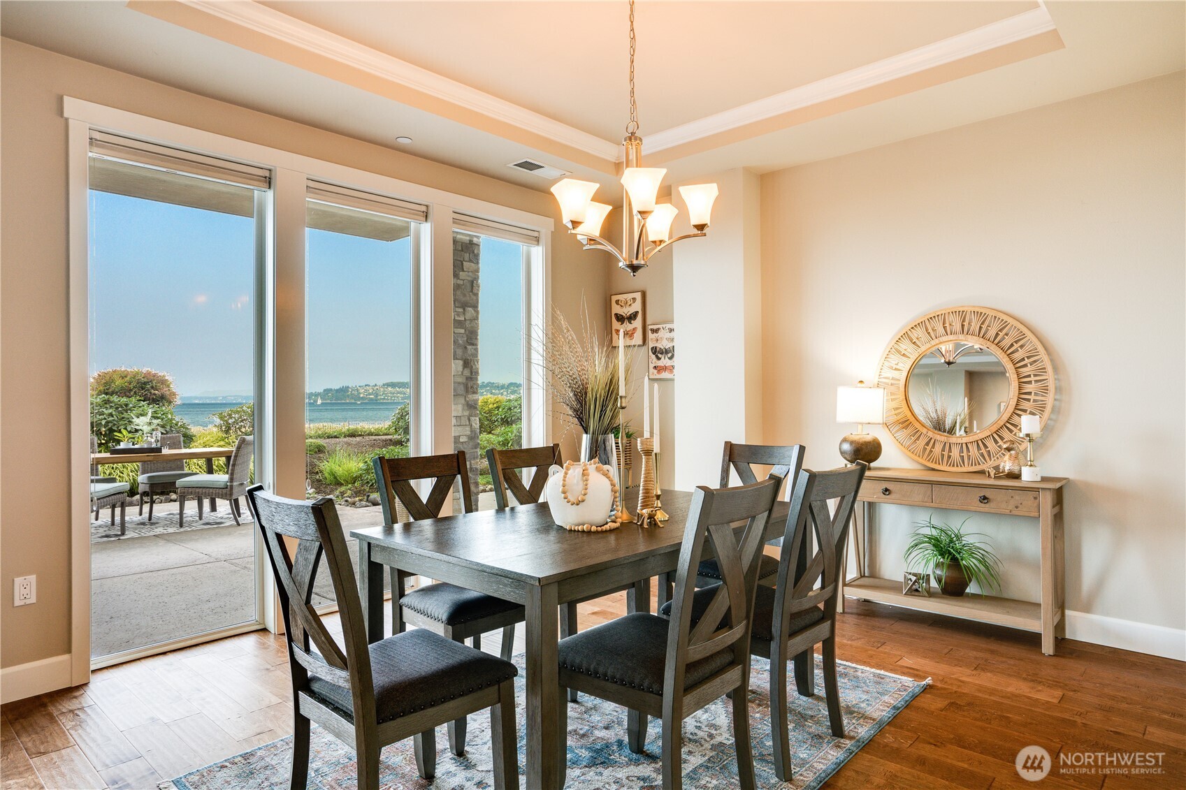 5105 Grand Loop, Unit 105 Tacoma, WA 98407 - Photo 15 of 39 a dining room with furniture a chandelier and wooden floor