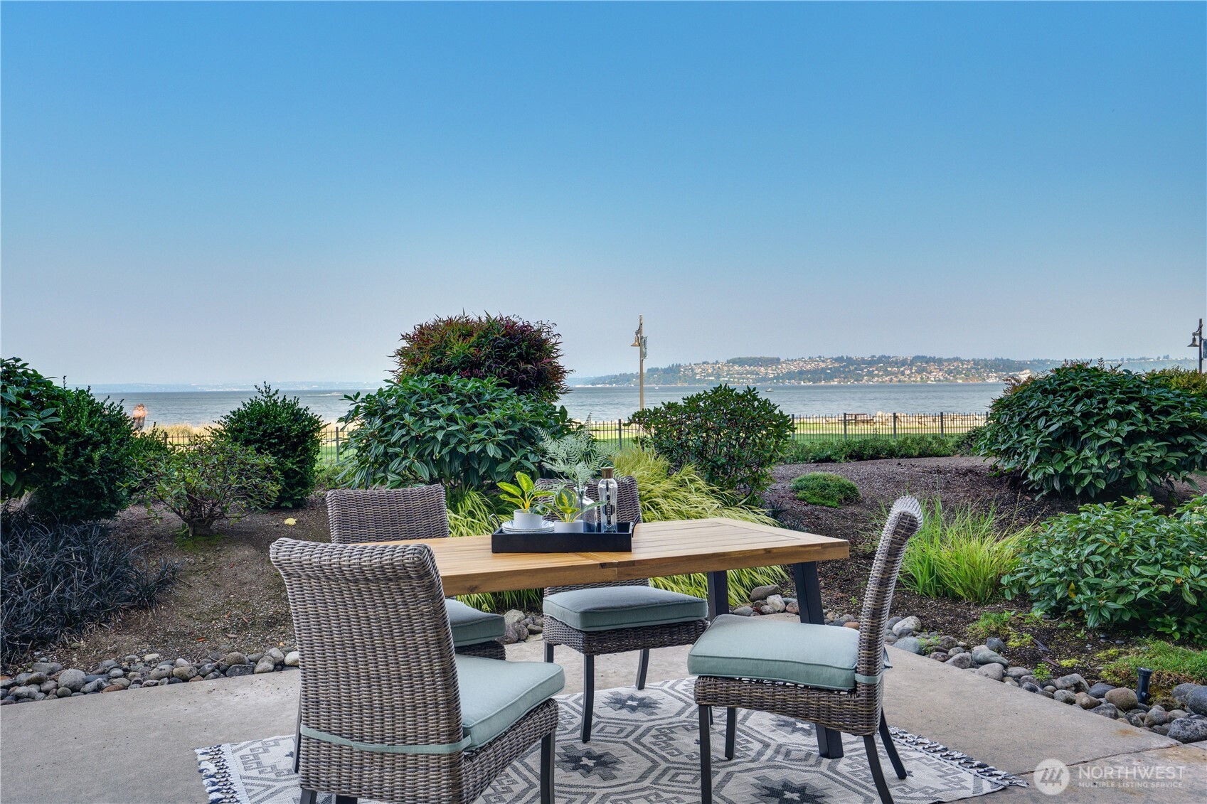 5105 Grand Loop, Unit 105 Tacoma, WA 98407 - Photo 16 of 39 a view of a chairs and table in patio