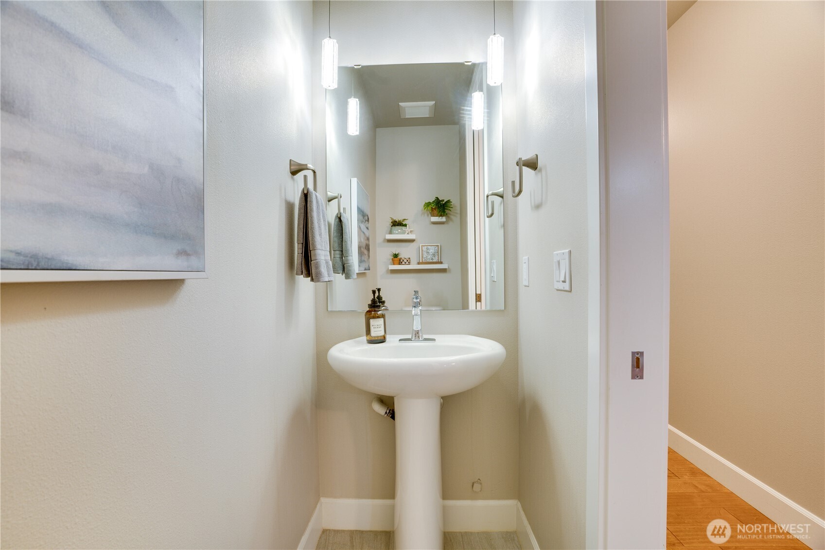 5105 Grand Loop, Unit 105 Tacoma, WA 98407 - Photo 20 of 39 a bathroom with a sink and a mirror