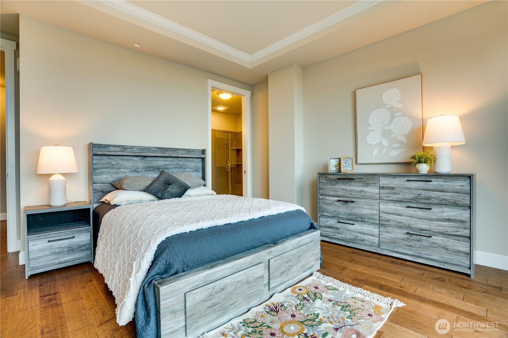 5105 Grand Loop, Unit 105 Tacoma, WA 98407 - Photo 22 of 39 a bedroom with a bed and a dresser