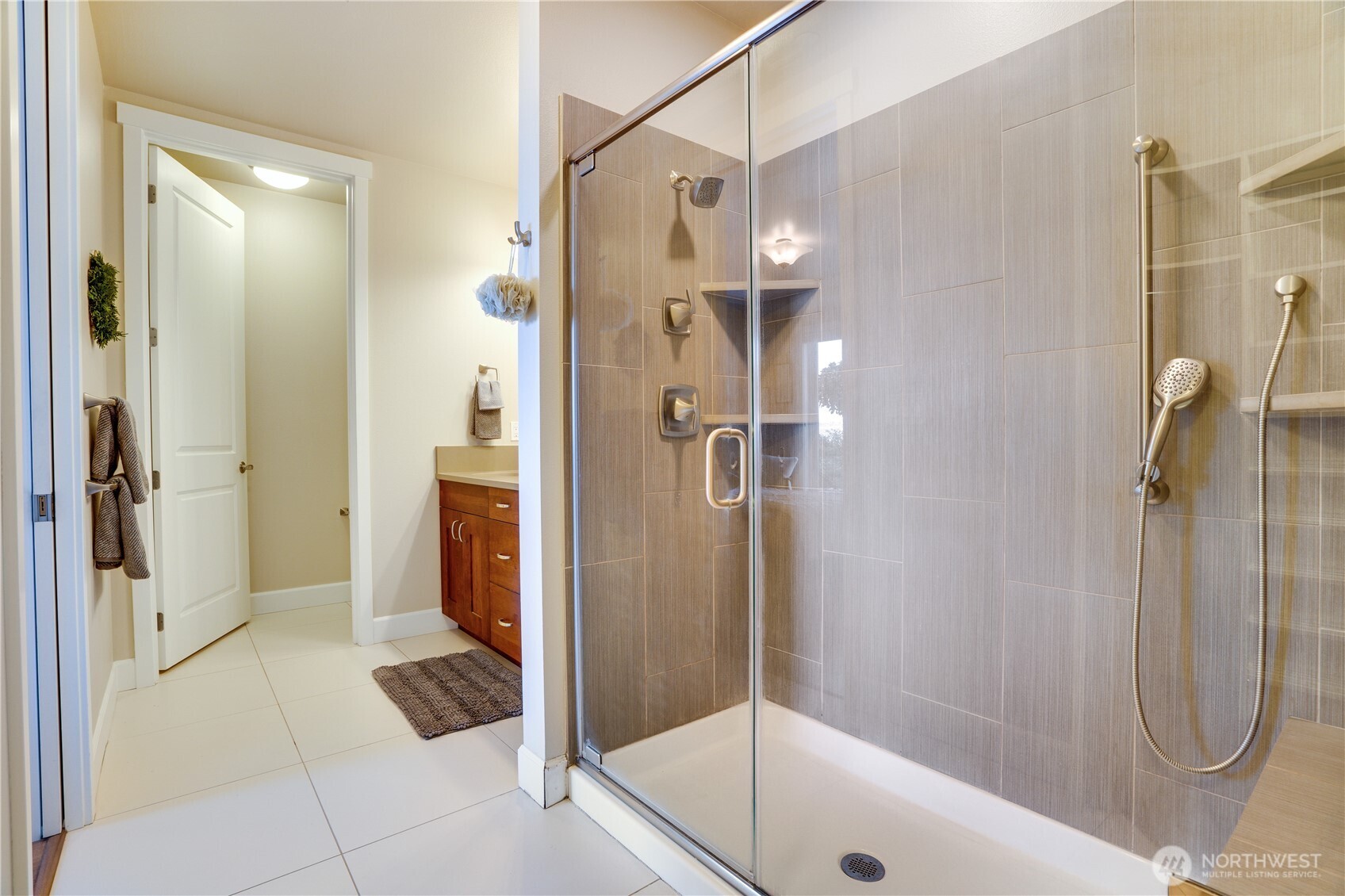 5105 Grand Loop, Unit 105 Tacoma, WA 98407 - Photo 23 of 39 a bathroom with a shower and a sink