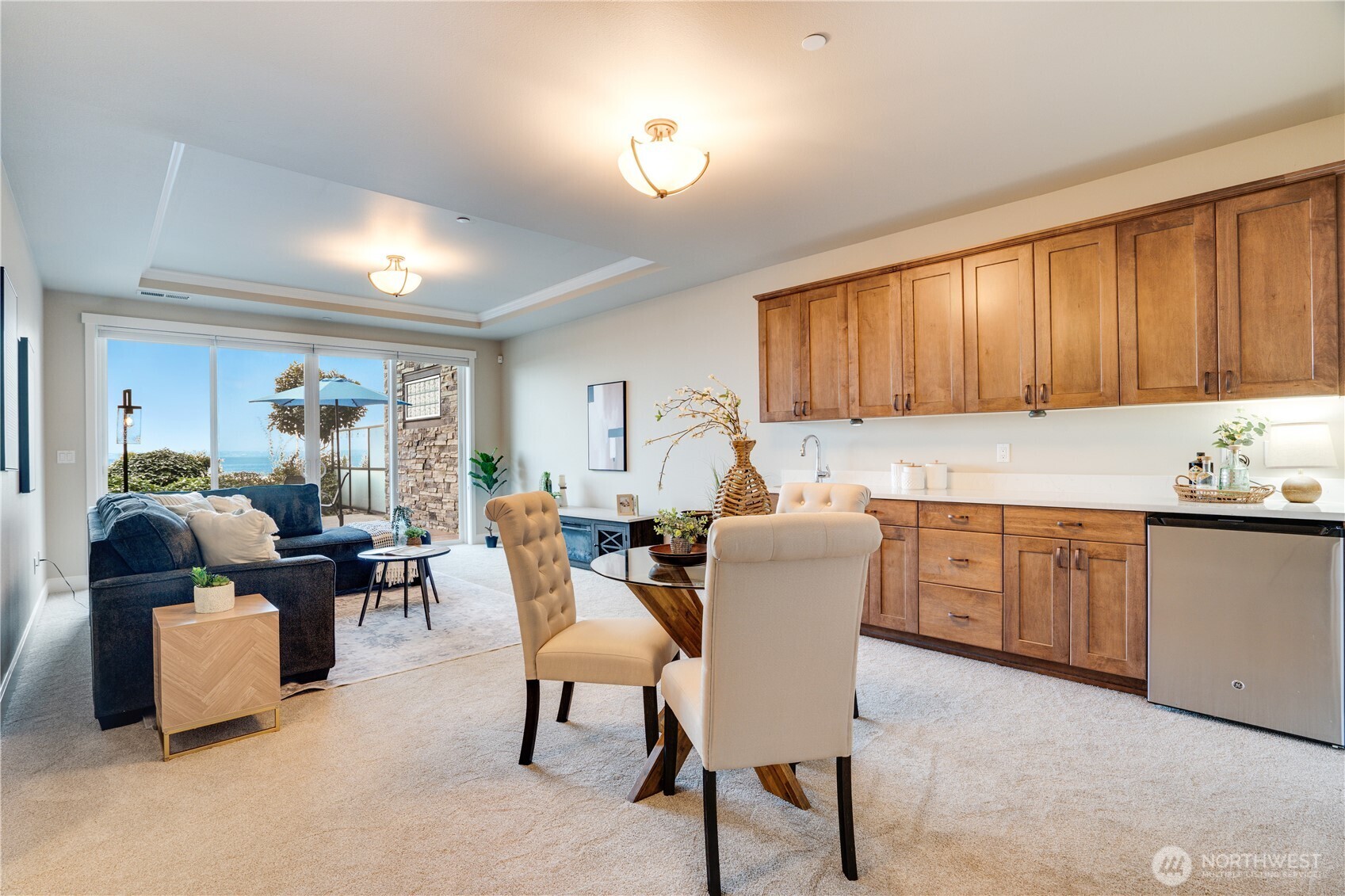 5105 Grand Loop, Unit 105 Tacoma, WA 98407 - Photo 27 of 39 a living room with furniture a dining table and kitchen view