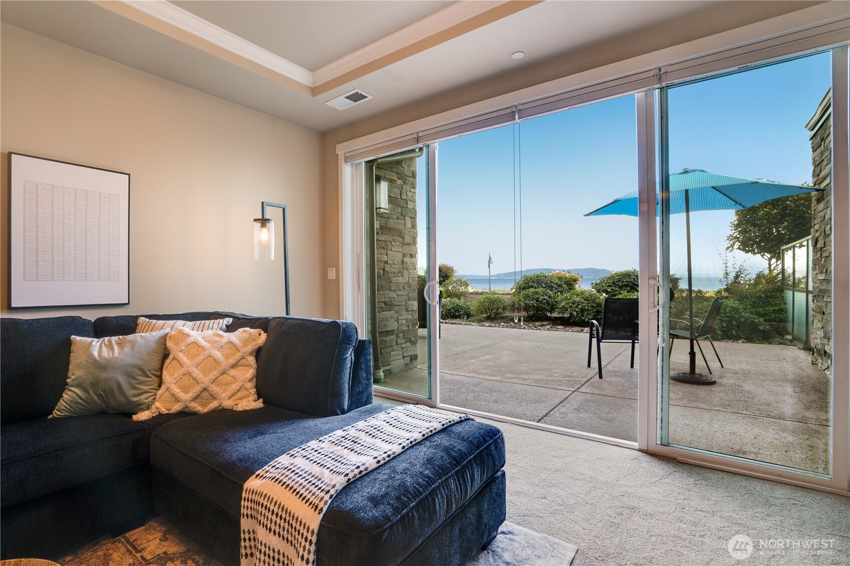 5105 Grand Loop, Unit 105 Tacoma, WA 98407 - Photo 29 of 39 a bedroom with a bed and a balcony view