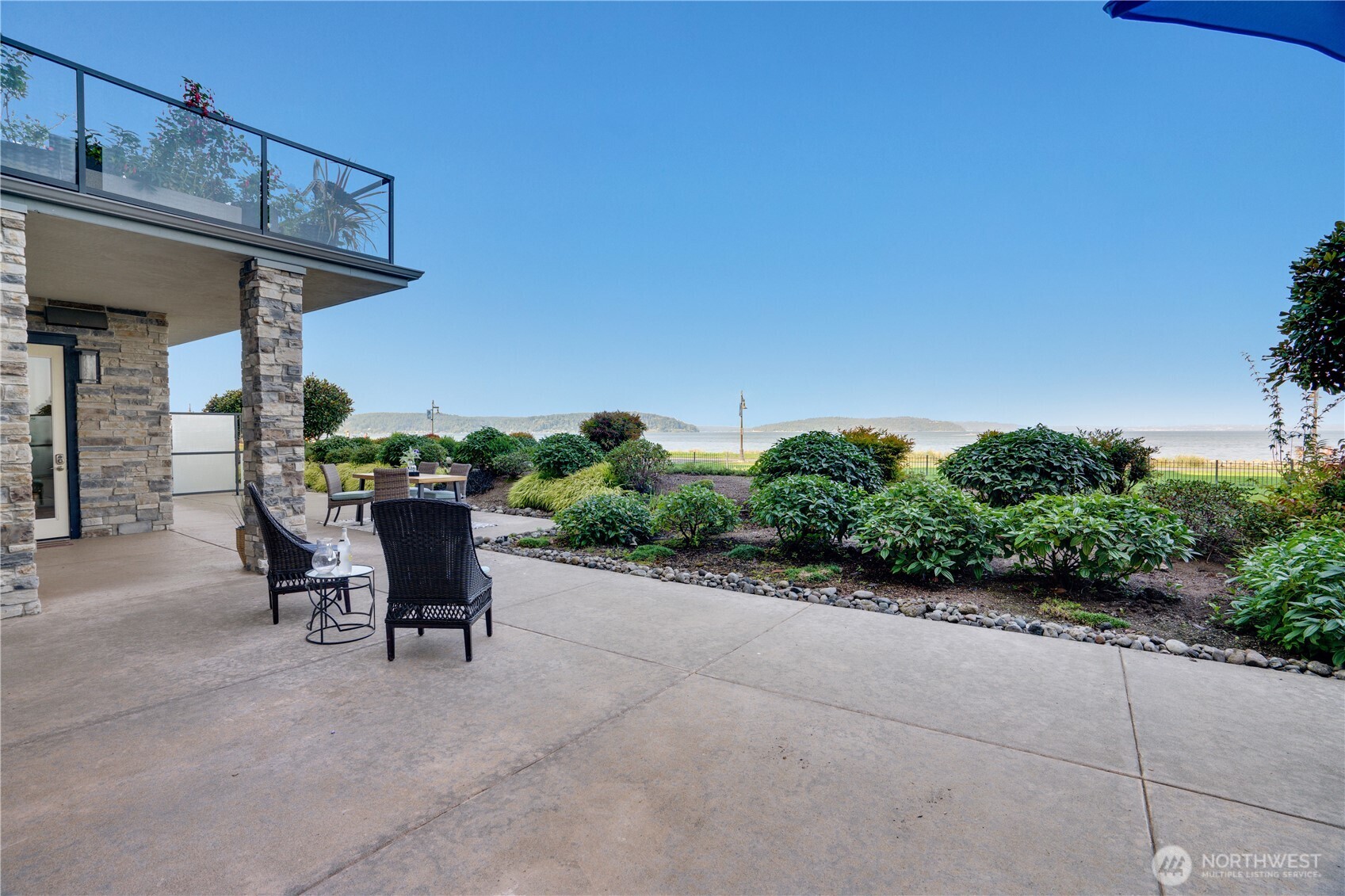 5105 Grand Loop, Unit 105 Tacoma, WA 98407 - Photo 30 of 39 a view of a chairs and table in a patio