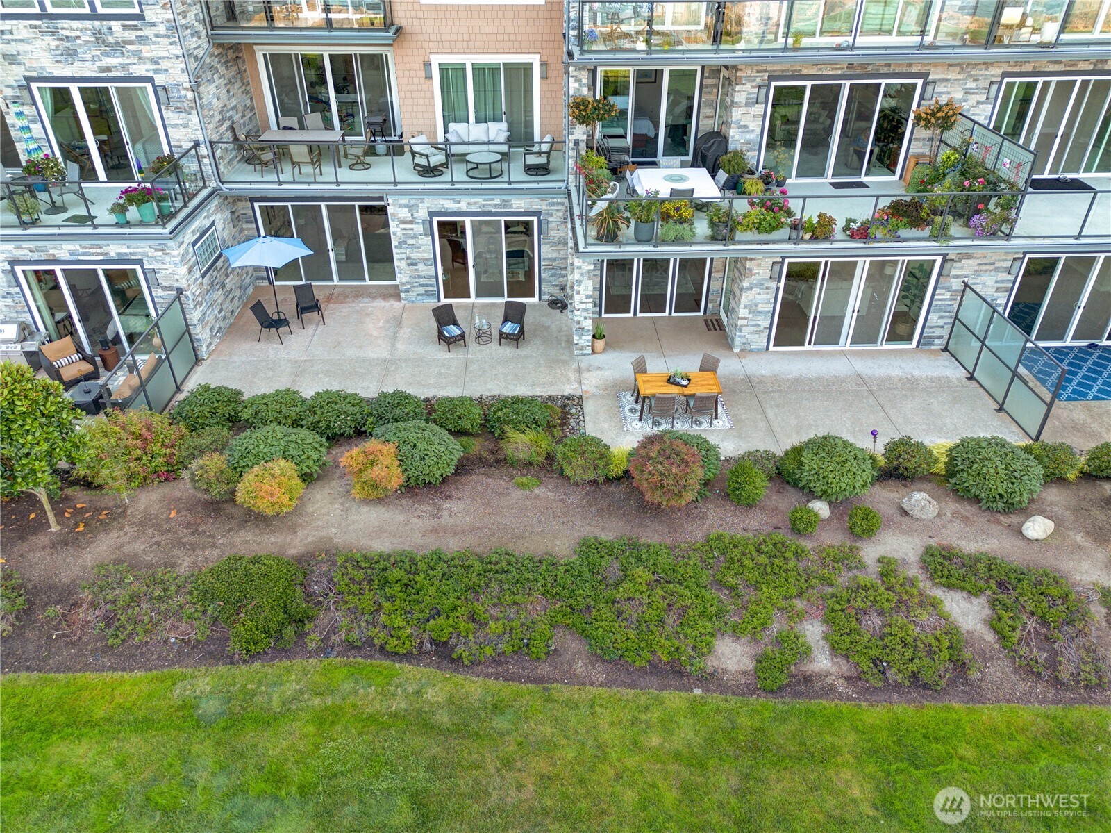 5105 Grand Loop, Unit 105 Tacoma, WA 98407 - Photo 3 of 39 an aerial view of house with yard