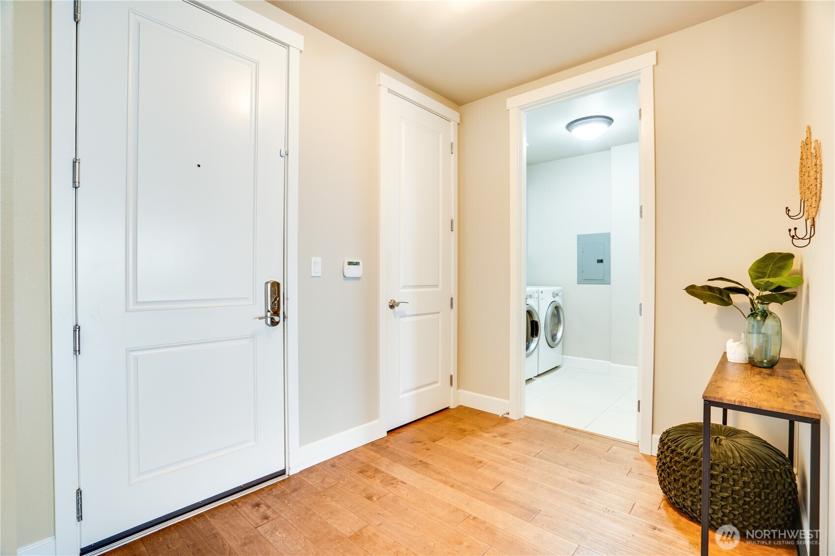 5105 Grand Loop, Unit 105 Tacoma, WA 98407 - Photo 5 of 39 a bedroom with a bed and a mirror