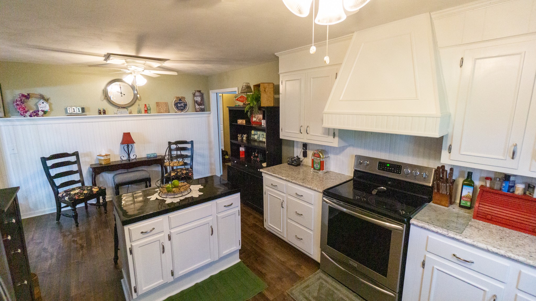 424 Dorris Road Portland, TN 37148 - Photo 17 of 48 a kitchen with stainless steel appliances kitchen island granite countertop a stove a sink and a refrigerator