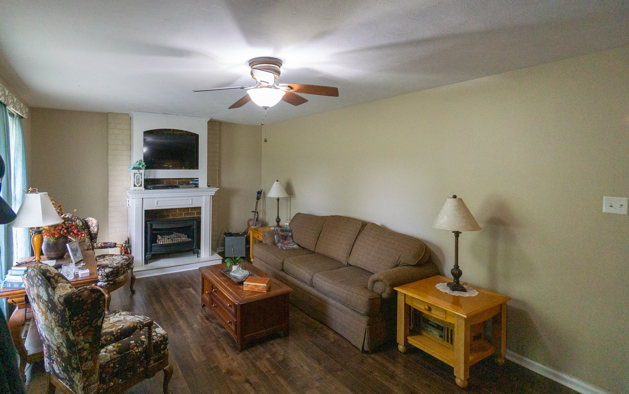 424 Dorris Road Portland, TN 37148 - Photo 21 of 48 a living room with furniture a flat screen tv and a fireplace
