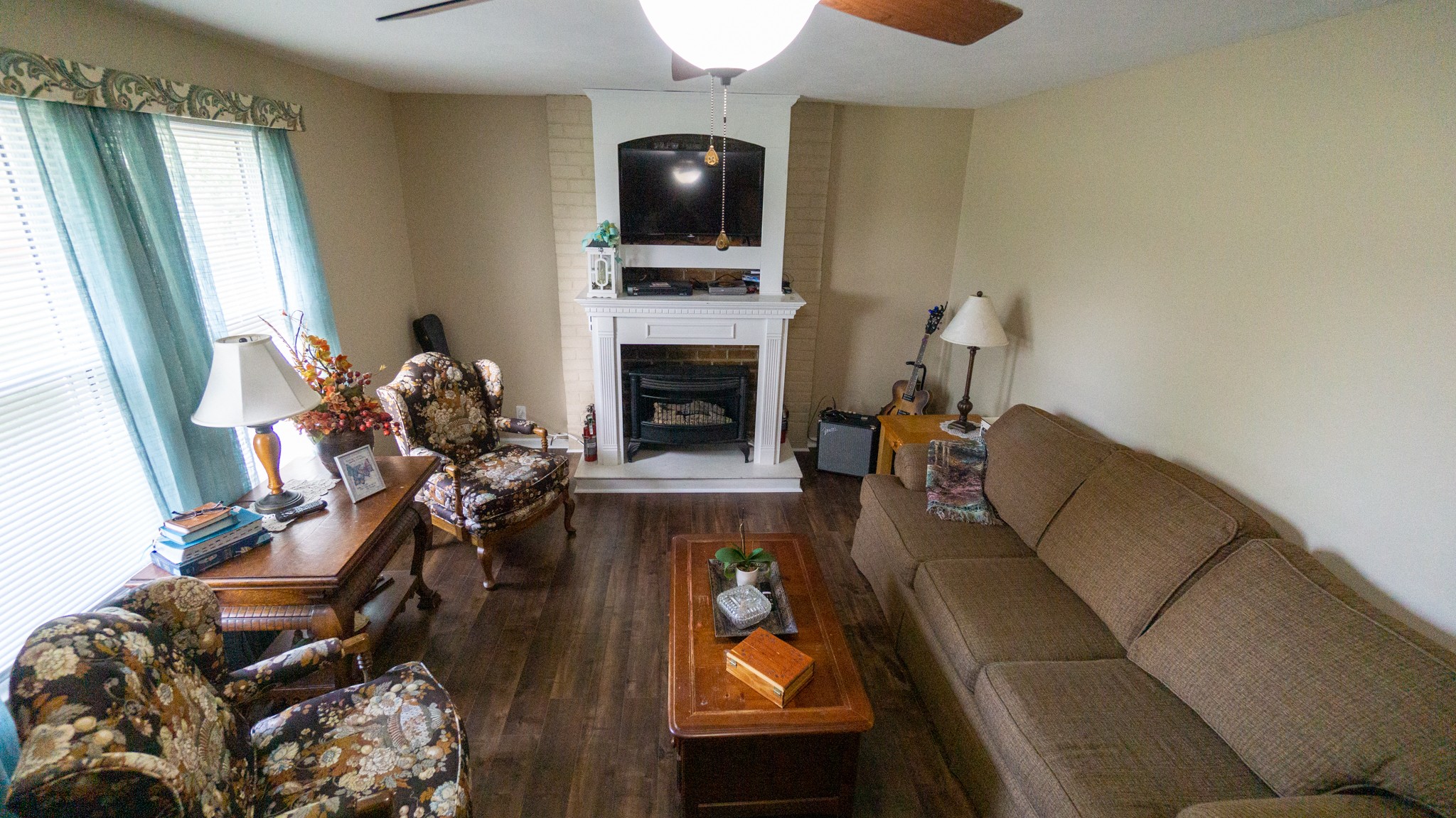 424 Dorris Road Portland, TN 37148 - Photo 37 of 48 a living room with furniture a flat screen tv and a fireplace