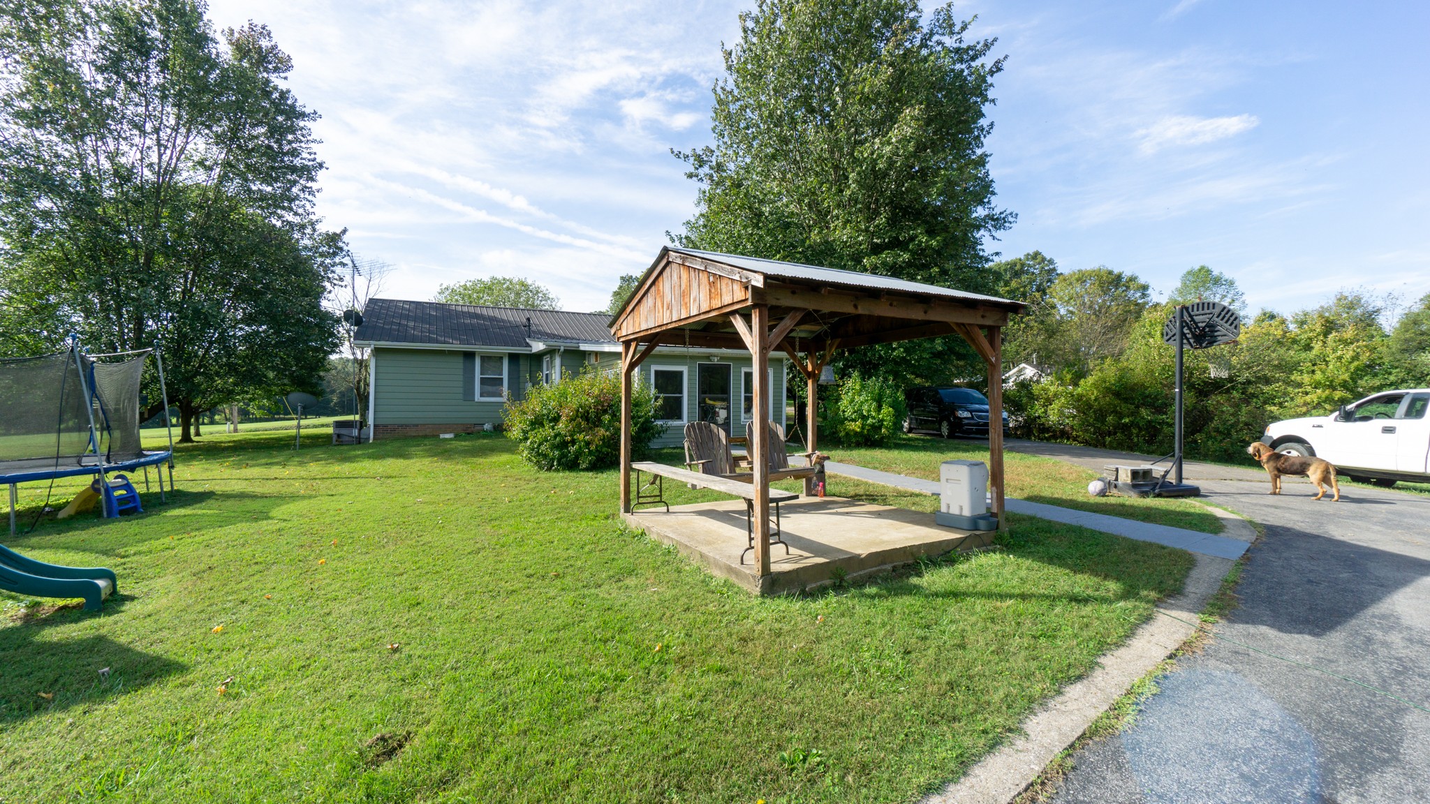 424 Dorris Road Portland, TN 37148 - Photo 44 of 48 a view of a house with a yard patio and a slide