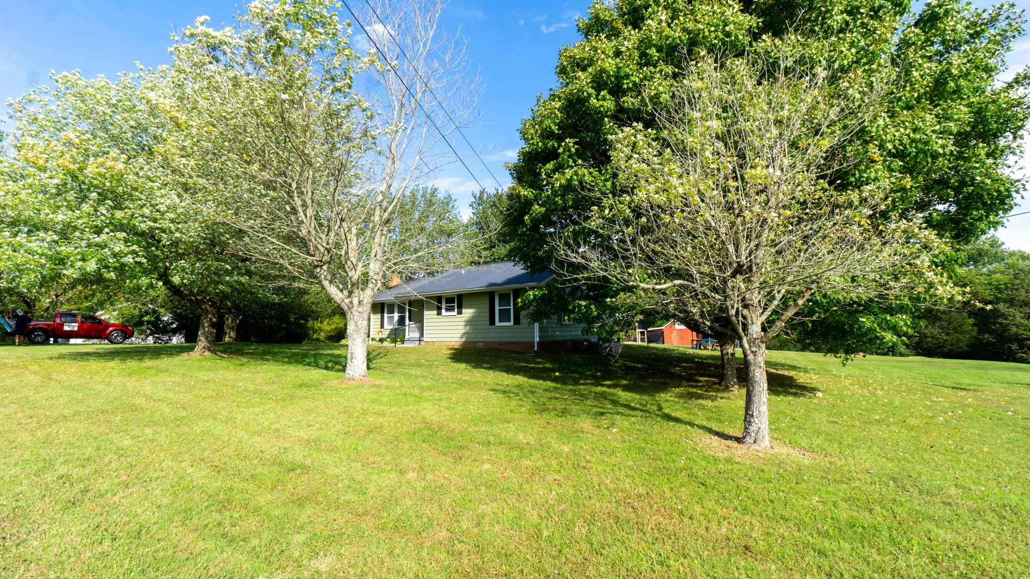 424 Dorris Road Portland, TN 37148 - Photo 47 of 48 a view of a house with a big yard and large trees