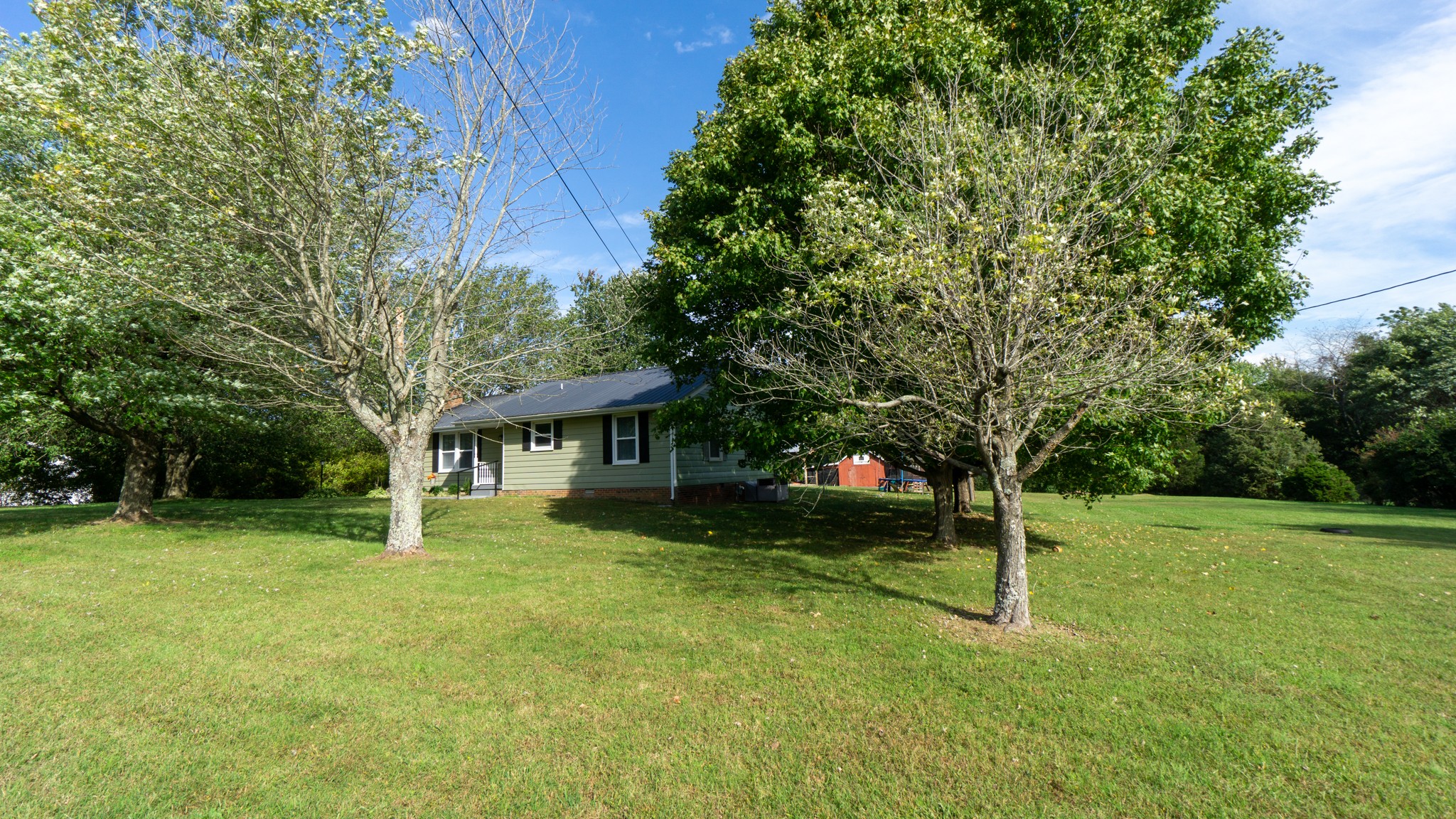 424 Dorris Road Portland, TN 37148 - Photo 8 of 48 a backyard of a house with lots of green space