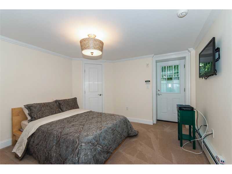 Undisclosed Address Riverside, CT 06878 - Photo 11 of 25 a bedroom with a bed and a television