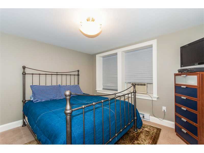 Undisclosed Address Riverside, CT 06878 - Photo 12 of 25 a bedroom with a bed and flat screen tv