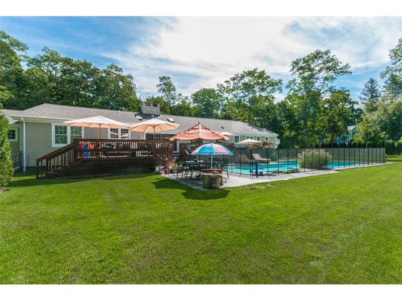 Undisclosed Address Riverside, CT 06878 - Photo 21 of 25 a aerial view of a house with a big yard