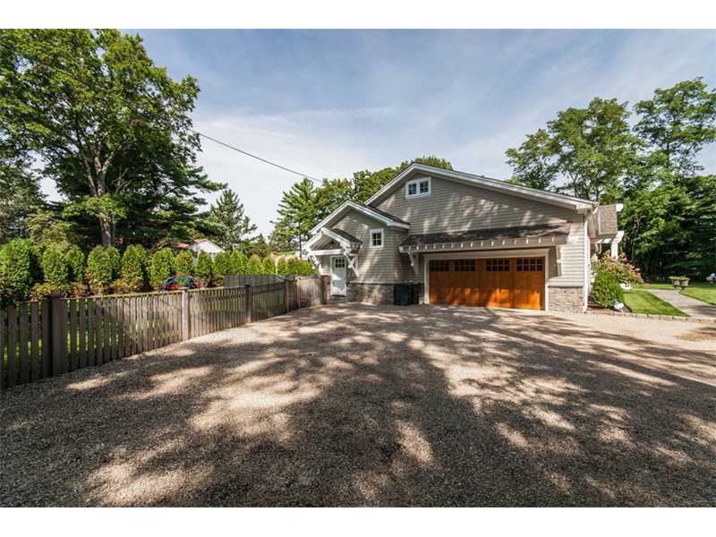 Undisclosed Address Riverside, CT 06878 - Photo 25 of 25 a front view of a house with a yard