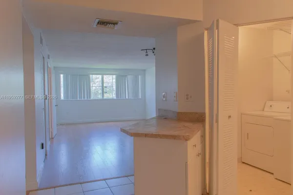 a view of kitchen and utility room