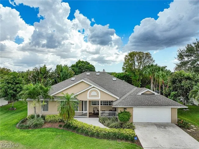a aerial view of a house with garden and trees