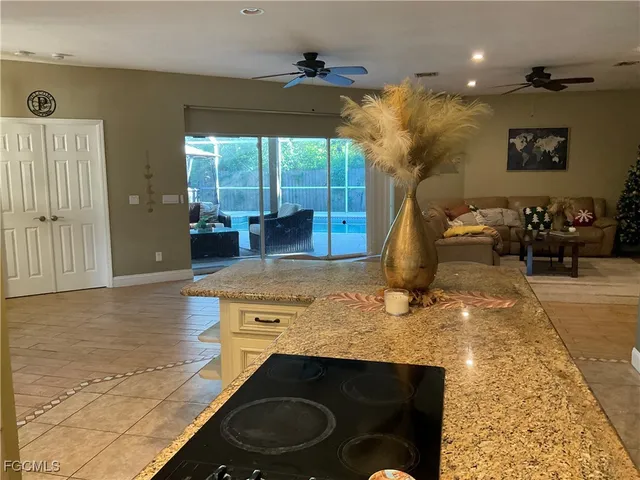 a kitchen with sink a table and chairs