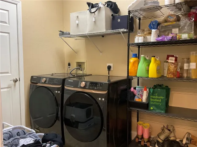 a utility room with dryer and washer