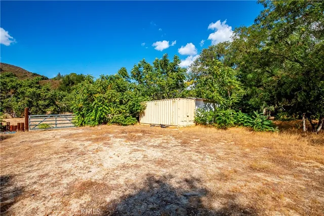 a backyard of a house with lots of green space