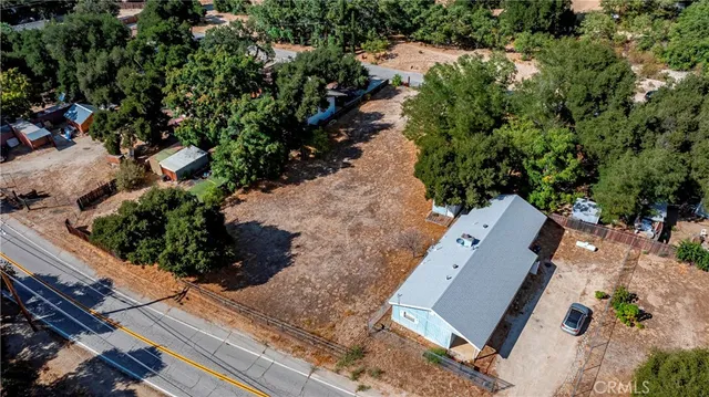 an aerial view of house with yard