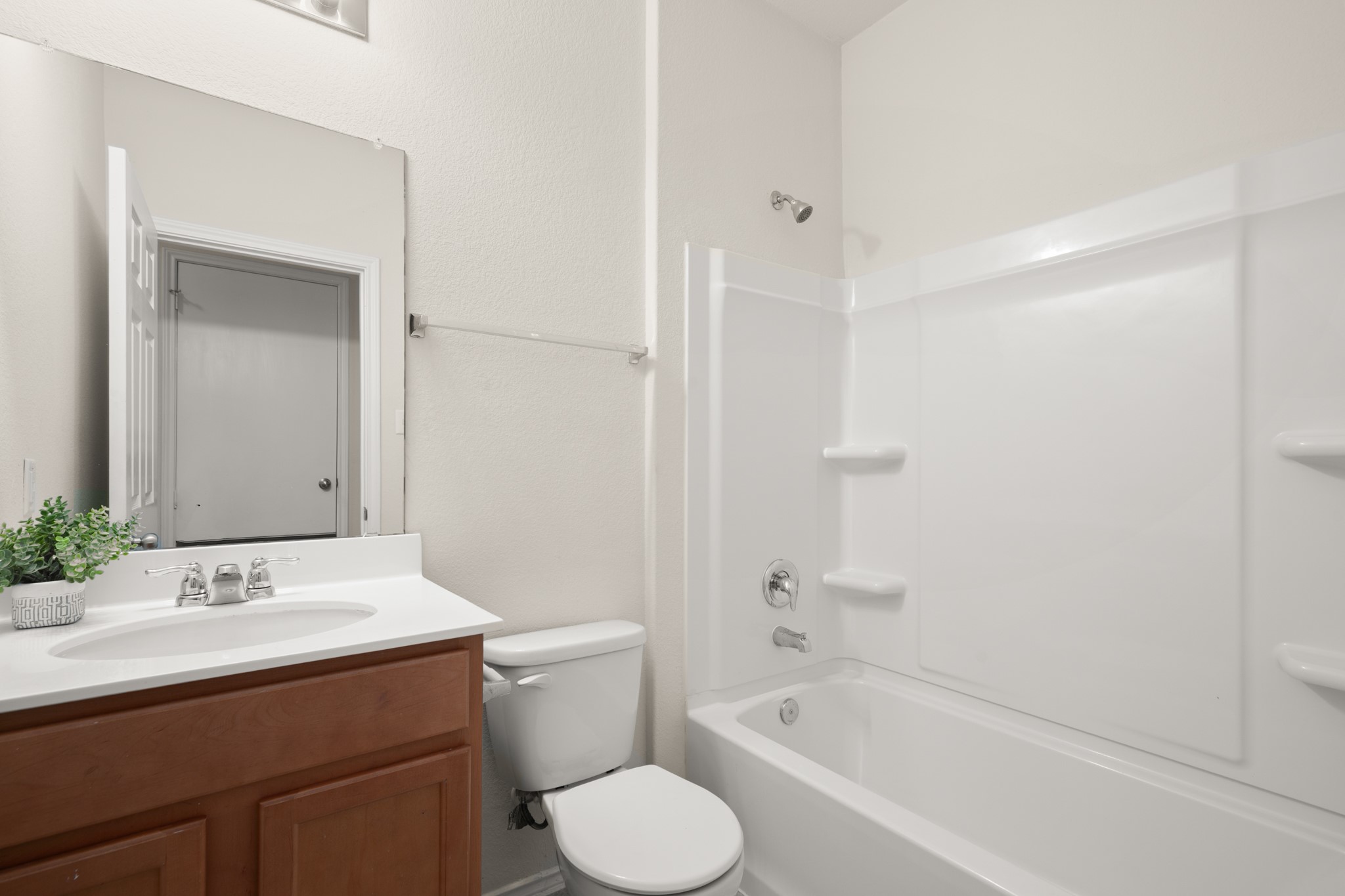 380 Bonnet Boulevard Georgetown, TX 78628 - Photo 24 of 26 a bathroom with a sink toilet and shower