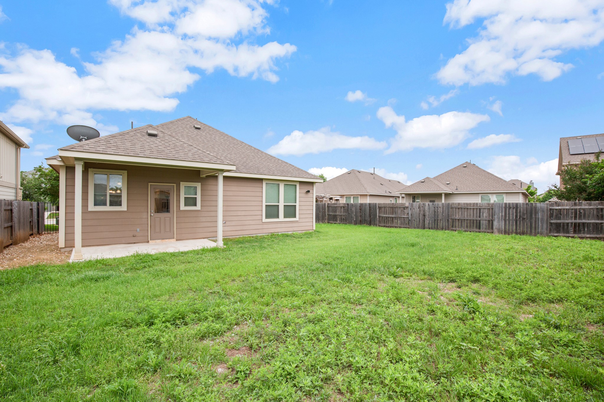 380 Bonnet Boulevard Georgetown, TX 78628 - Photo 7 of 26 a view of a house with a backyard