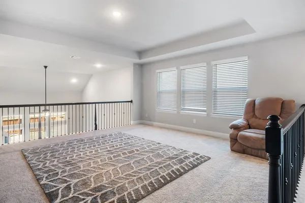 a view of a livingroom with furniture and windows